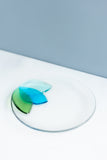 handmade Fused glass appetizer plate with floral petals on one side in shades of blue and green made by people with disabilities 