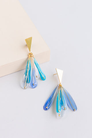 Plume drop resin earrings in blue and teal with gold triangular findings and feather design 