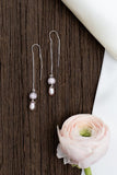 Eden long and thin drop beaded earrings made with pearls and swarovski elements and silver findings handmade by people with disabilities in white